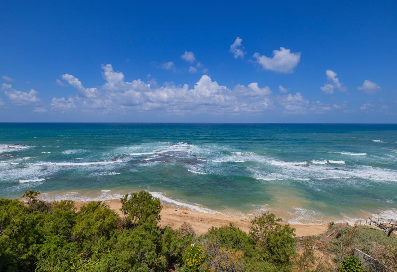 Panoramic Mediterranean sea view from the property — turquoise water and private beach